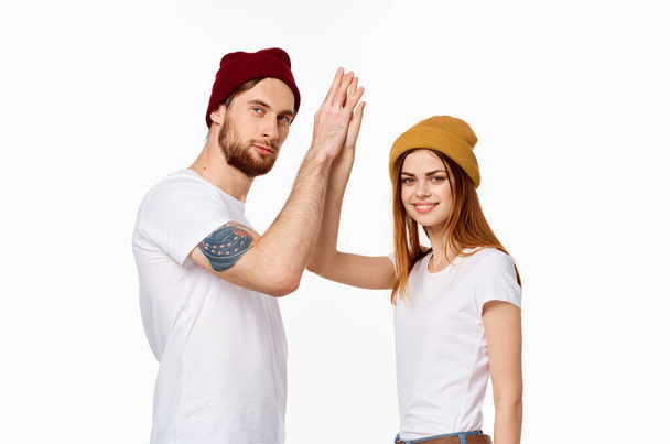 cheerful young couple white t-shirts in fashionable clothes modern style - Foto, Imagen