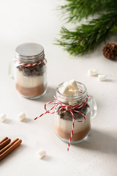 Homemade edible Christmas gift in glass jar for making chocolate drink. - Photo, Image