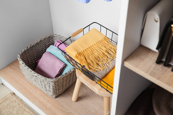 Modern organizers with clothes in wardrobe - Photo, Image