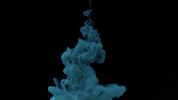 Blue-green cloud of ink. Cosmic magic background. Waves and drops of blue-green colors. Beautiful abstract background. Blue-green watercolor ink in water on a black background. - Fotografie, Obrázek