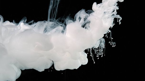 White abstract background. White watercolor ink in water on a black background. - Photo, Image