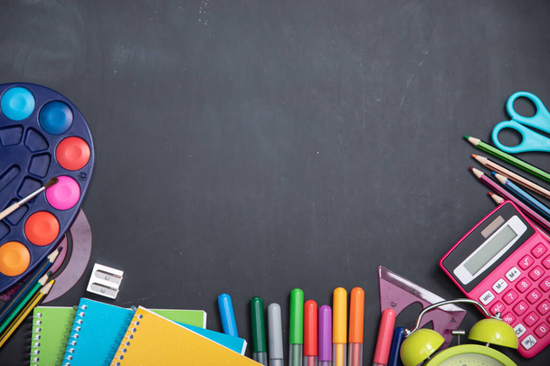 Education, back to school concept. School supplies on blackboard with copy space. - 写真・画像