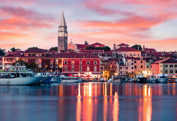 Splendid sunset of old fishing town Isola. Colorful spring evening on Adriatic Sea. Beautiful seascape of Slovenia, Europe. Traveling concept background. Artistic style post processed photo. - Photo, Image