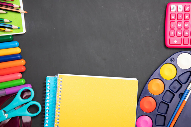 Education, back to school concept. School supplies on blackboard with copy space. - 写真・画像