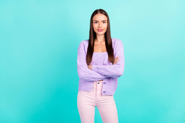 Photo of confident successful lady crossed hands posing wear purple cardigan isolated teal color background - Zdjęcie, obraz