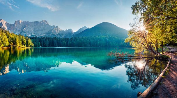 Colorful summer view of Fusine lake. Bright morning scene of Julian Alps with Mangart peak on background, Province of Udine, Italy, Europe. Traveling concept background. - Photo, Image