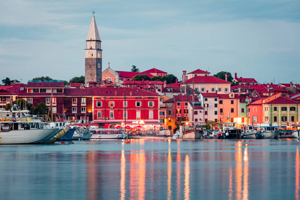 Attractive evening cityscape of old fishing town Isola. Colorful spring seascape of Adriatic Sea. Beautiful outdoor scene of Slovenia, Europe. Traveling concept background.  - Photo, Image