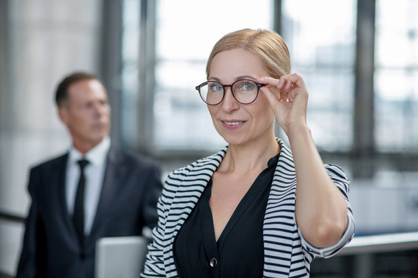 Smiling successful business lady touching glasses - Photo, image