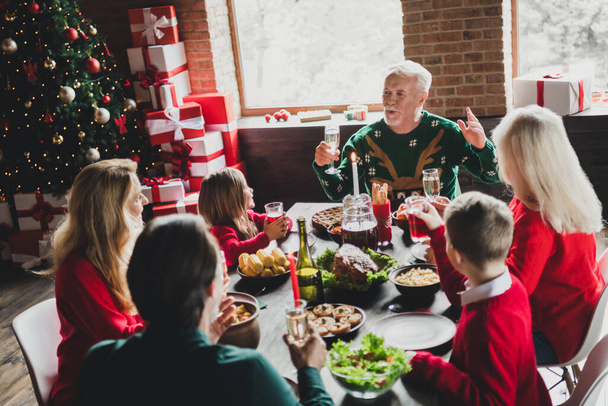Photo portrait of full family listening to grandpa saying toast drinking champagne on christmas - Foto, immagini