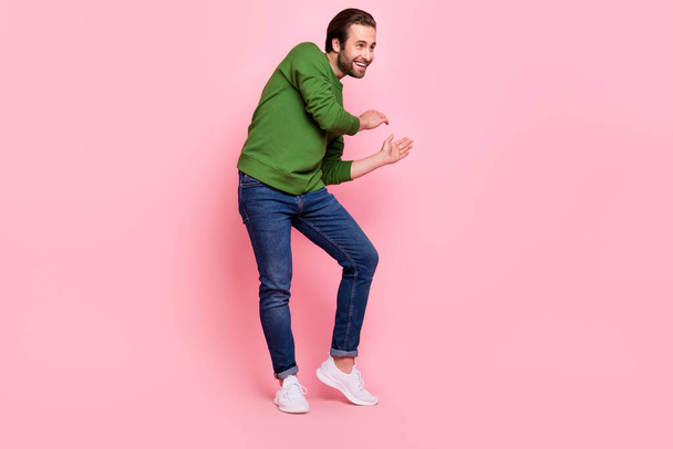 Full length photo of positive glad people dancing look empty space beaming smile isolated on pink color background - Zdjęcie, obraz