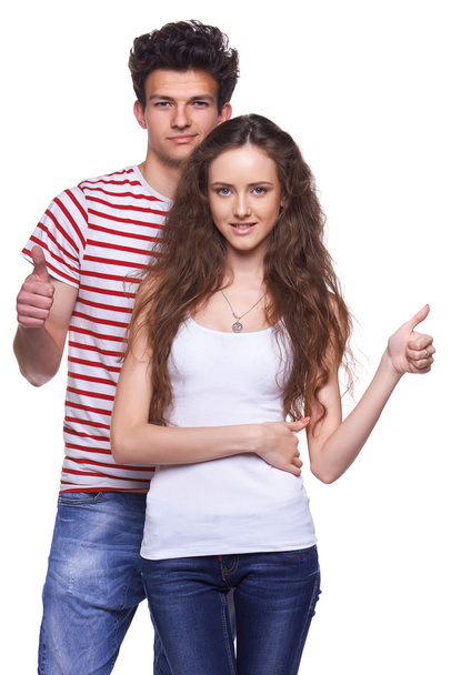 Young casual couple giving thumbs up - Foto, Bild