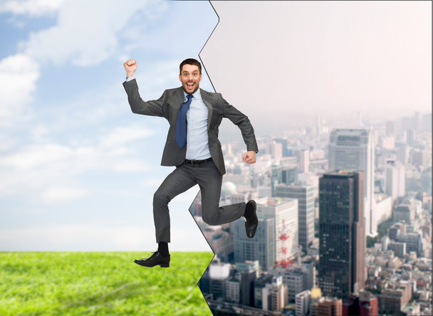 lachende gelukkig zakenman springen - Foto, afbeelding