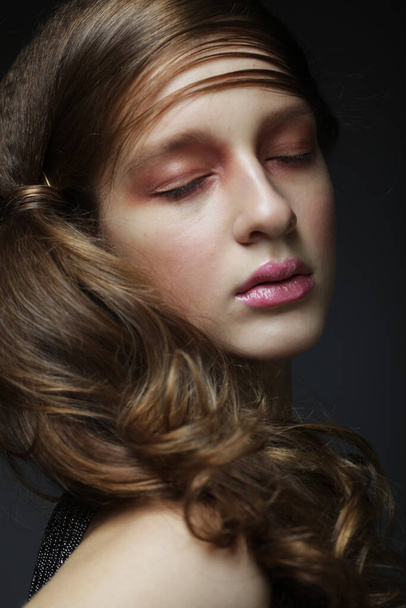 Beauty concept: Beautiful girl with long wavy hair. Blonde with curly hairstyle and pink lips. - Fotografie, Obrázek
