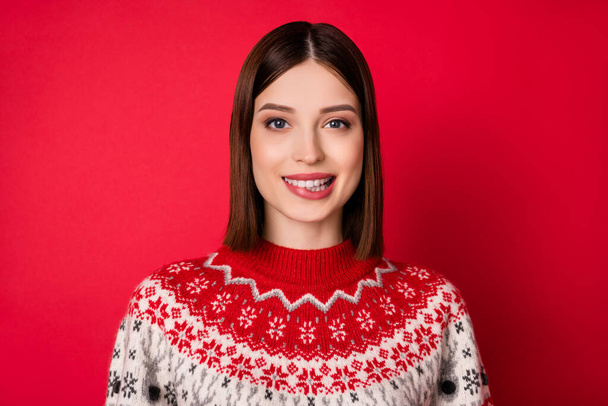 Photo of dreamy tricky young woman dressed prink pullover smiling biting lip isolated red color background - Fotografie, Obrázek