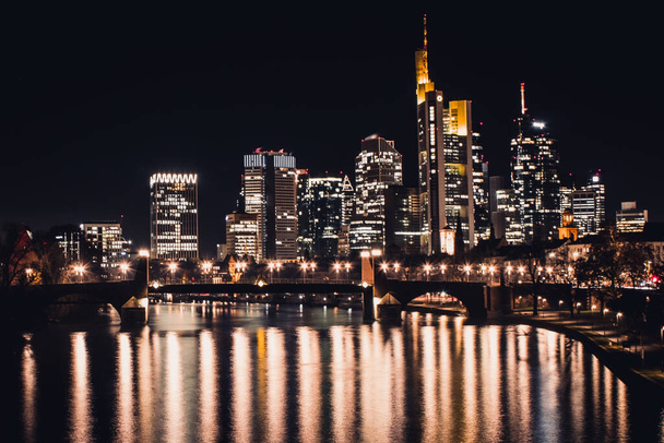 A scenic view of the city lights in Frankfurt, Germany at night - Фото, изображение