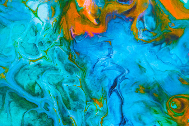 Abstract background from spilled paints. Multi-colored paints on canvas. - 写真・画像