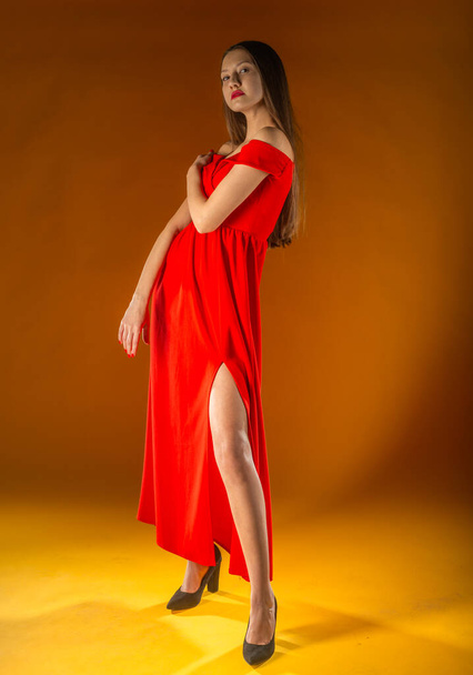 Gorgeous woman. Portrait of beautiful smiling young woman standing in cute red dress isolated on white background in full length. Sexy mixed race Chinese Asian / Caucasian female model. - 写真・画像