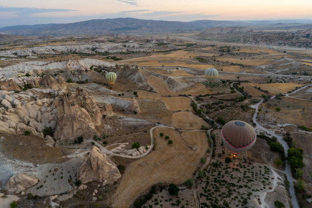 Aerial wide angle Panoramic view with hot air balloons flying over Cappadocia, Central Anatolia, Turkey, at sunrise. - Valokuva, kuva