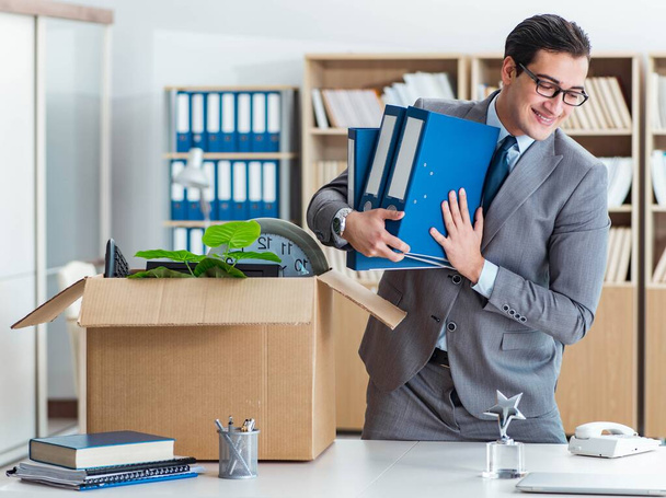 Man moving office with box and his belongings - Photo, Image