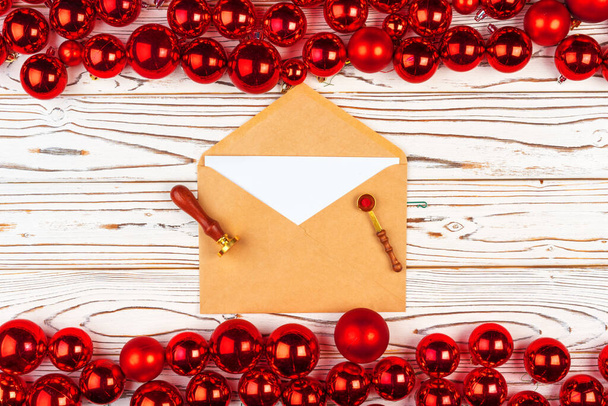 Christmas greeting card or letter against backround with red baubles - Photo, Image