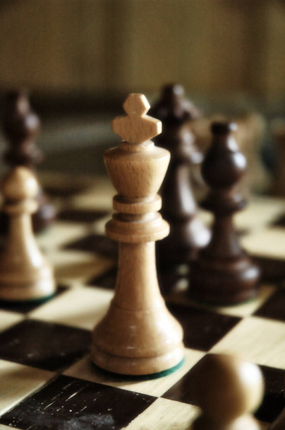 A vertical shot of a chessboard with pieces - Φωτογραφία, εικόνα