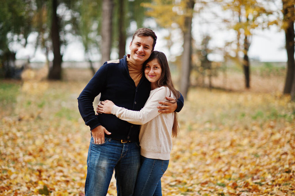 Lovely couple at autumn leaves park. - Fotografie, Obrázek