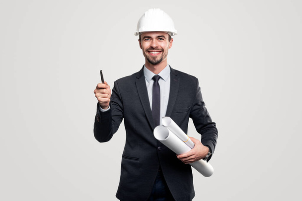 Smiling contractor with drafts and pen - Foto, Imagen