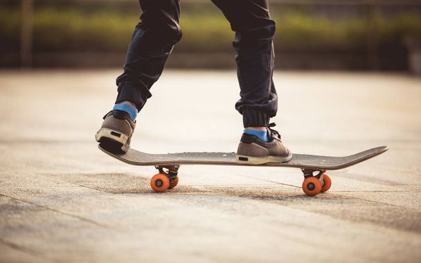 Skateboarder skateboarding outdoors in city - 写真・画像