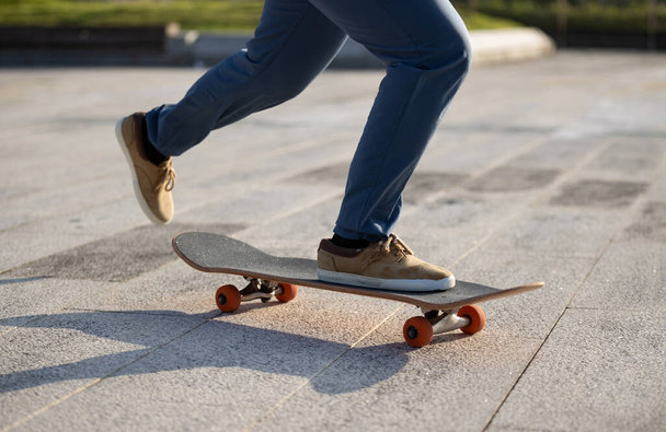 Skateboarder skateboarding outdoors in city - Photo, image