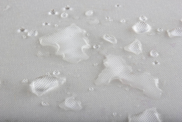 Water drop on the fabric. - Photo, Image