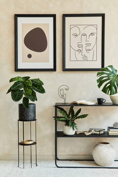 Creative composition of stylish modern living room interior with two mock up poster frames, black geometric commode, plants and personal accessories. Neutral colors. Template. - 写真・画像
