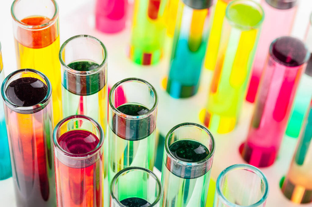 Still life in laboratory. Test tubes with colorful chemicals - Foto, imagen