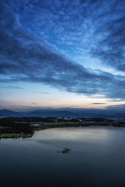 Sunset view over Gyeongpoho lake a famous landmark in Gangneung, South Korea - Photo, Image