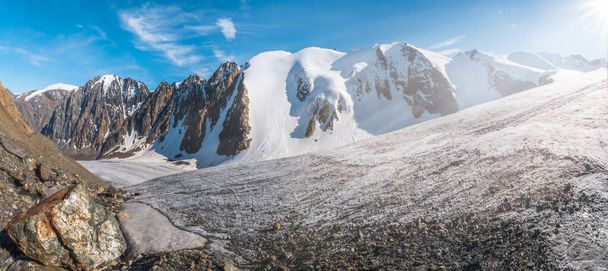 Wide panorama of the big glacier, high in the mountains, covered by snow and ice. - Photo, Image