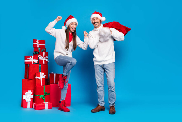 Full length body size view of attractive lucky cheerful couple delivering giftboxes dancing isolated over bright blue color background - Fotografie, Obrázek