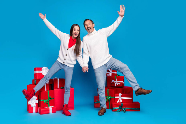 Full length body size view of attractive funky cheerful couple dancing having fun winter day isolated over bright blue color background - Foto, Bild