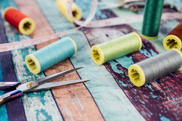 Close-up of color spools and tailor's scissors - Photo, Image