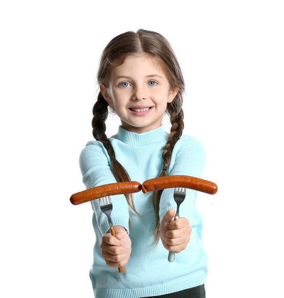Cute little girl with tasty sausages on white background - Fotó, kép