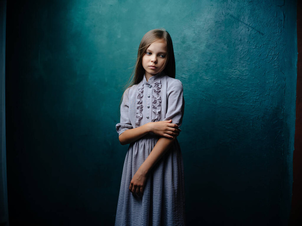 little girl in dress posing studio green background - Zdjęcie, obraz