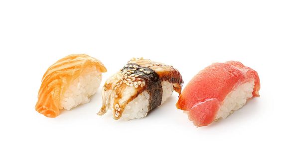 Různé lahodné sushi na bílém pozadí - Fotografie, Obrázek