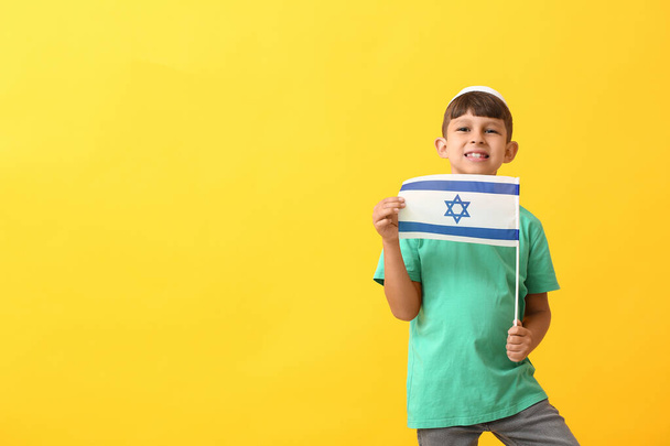 Little boy with the flag of Israel on color background - Foto, Imagen