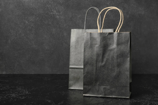 Shopping bags on dark background. Black Friday sale - Fotó, kép