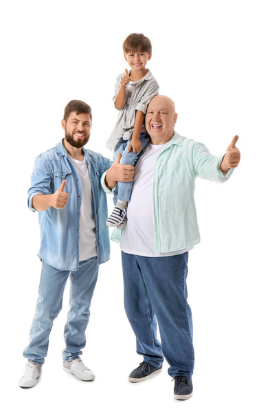 Szczęśliwy człowiek, jego synek i ojciec pokazujący kciuk na białym tle - Zdjęcie, obraz