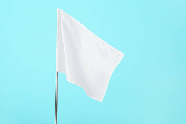 White flag on color background - Foto, afbeelding