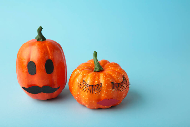 Halloween pumpkin with make up. Minimal Holiday season concept background. top view - Fotó, kép