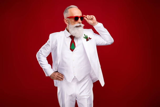 Photo of nice aged grey hair man look empty space wear eyewear white jacket isolated on red color background - Foto, imagen