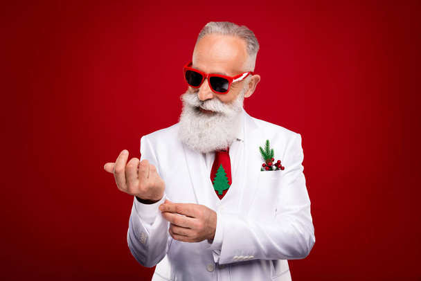Photo of cheerful happy old man fix sleeves wear sunglass smile entertainer isolated on red color background - Photo, image