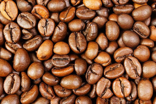 Background of coffee beans. It is popular for making a fragrant invigorating drink. - Photo, Image