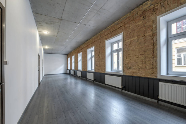 long white empty corridor in interior of entrance hall of modern apartments, office or clinic - Fotó, kép