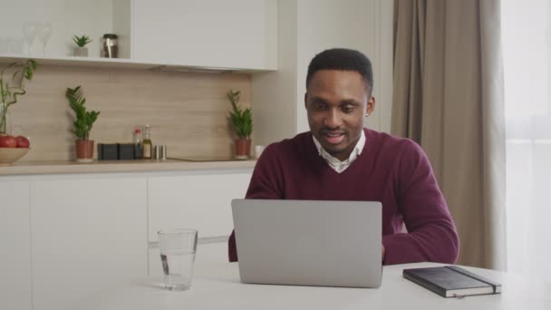 African-american guy feel excited receiving pleasant email message on computer - Filmati, video